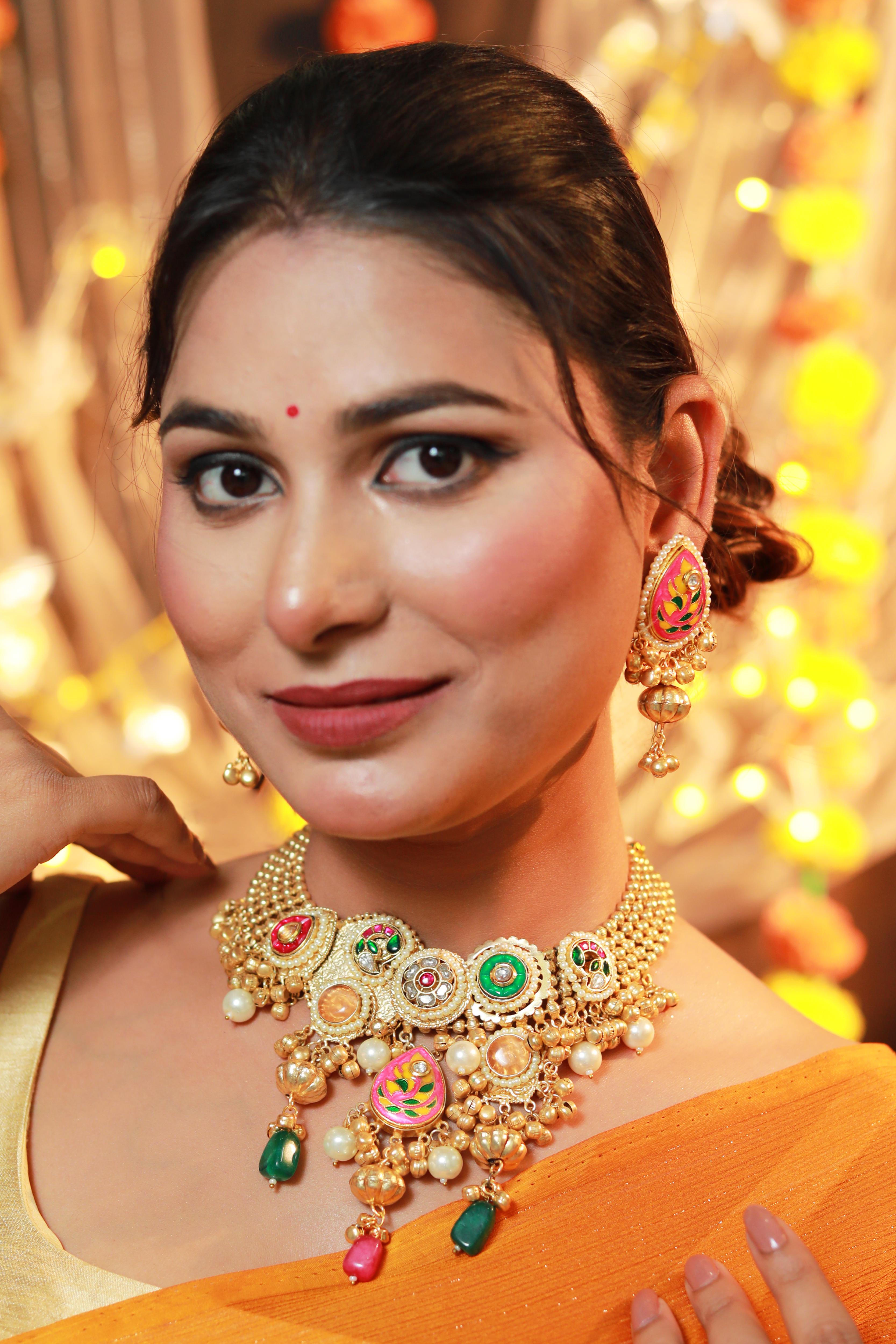 Viraasa Panchi Kundan Set